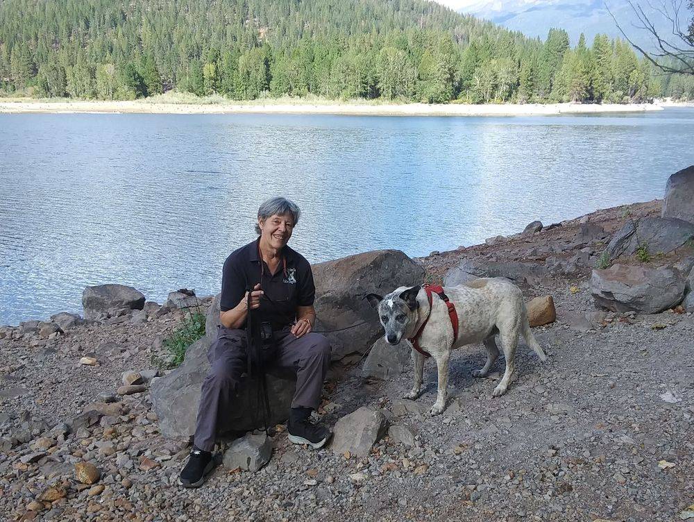 Emily Gaydos working with a happy dog in Mount Shasta